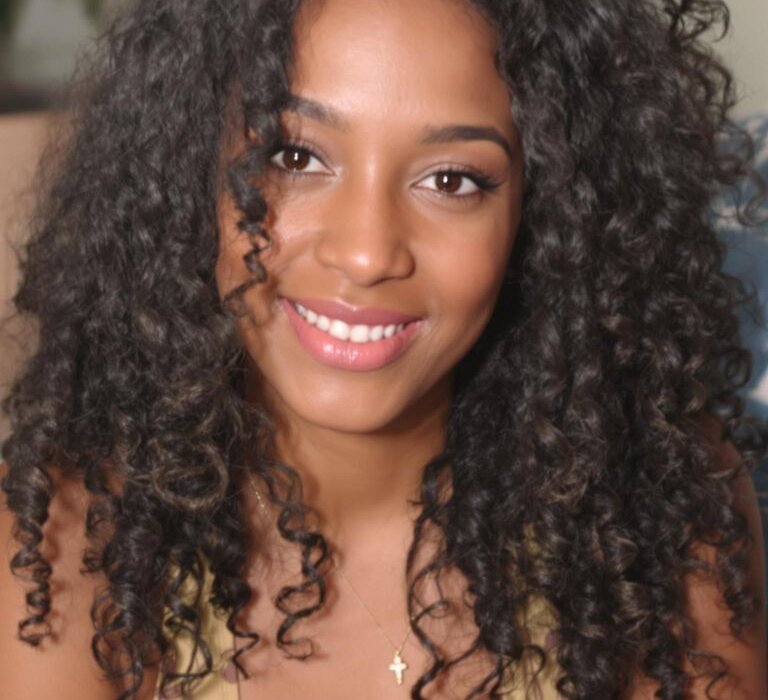 Natural curly hair styled without heat on smiling woman face